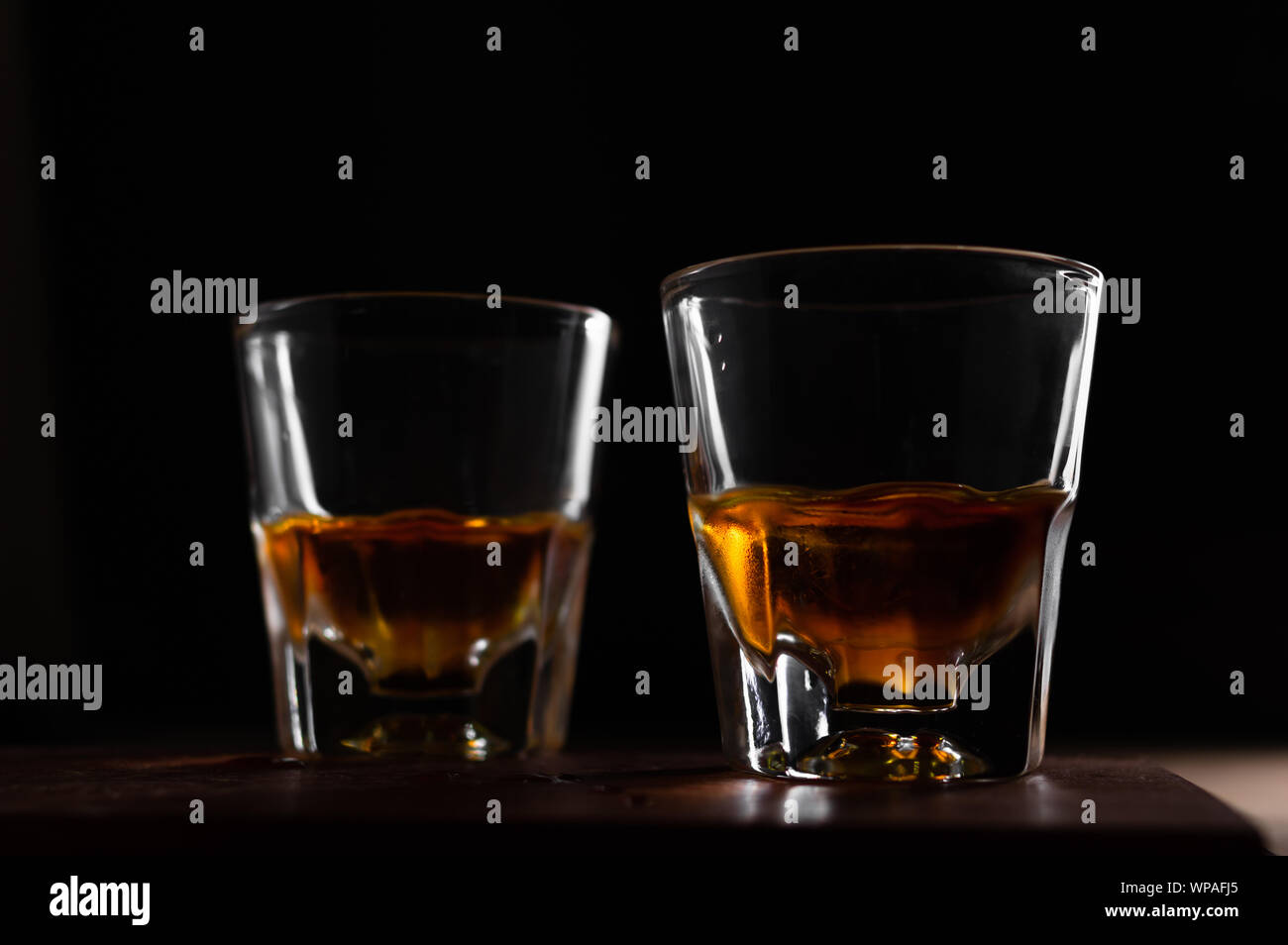 The glass of liquor in the dark Stock Photo Alamy