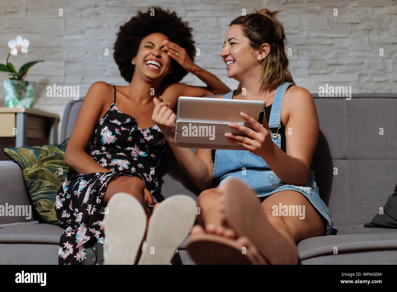 Two women looking at the tablet Stock Photo