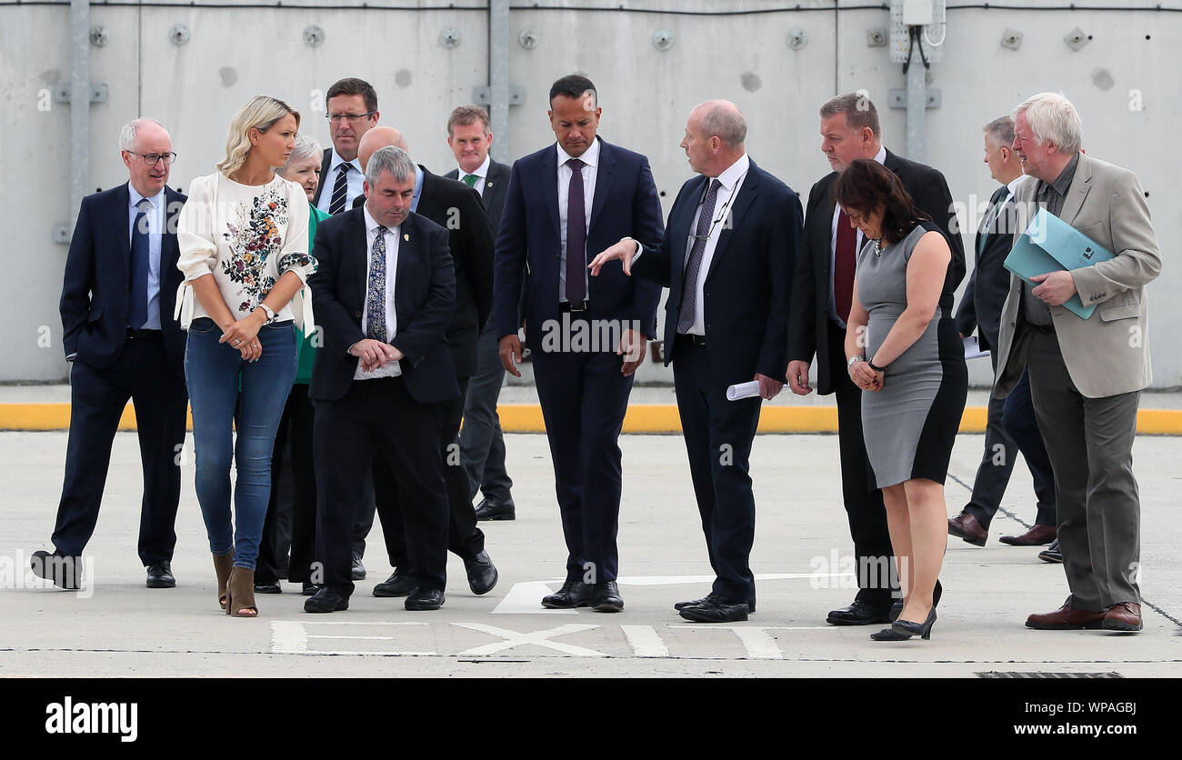Taoiseach Leo Varadkar (centre) and European Affairs Minister Helen McEntee (second left) with port and customs officials during a visit to new physical infrastructure at Dublin Port which has been put in place to meet the requirements for customs, SPS and health checks on consignments of goods imported from or transiting the UK. Stock Photo