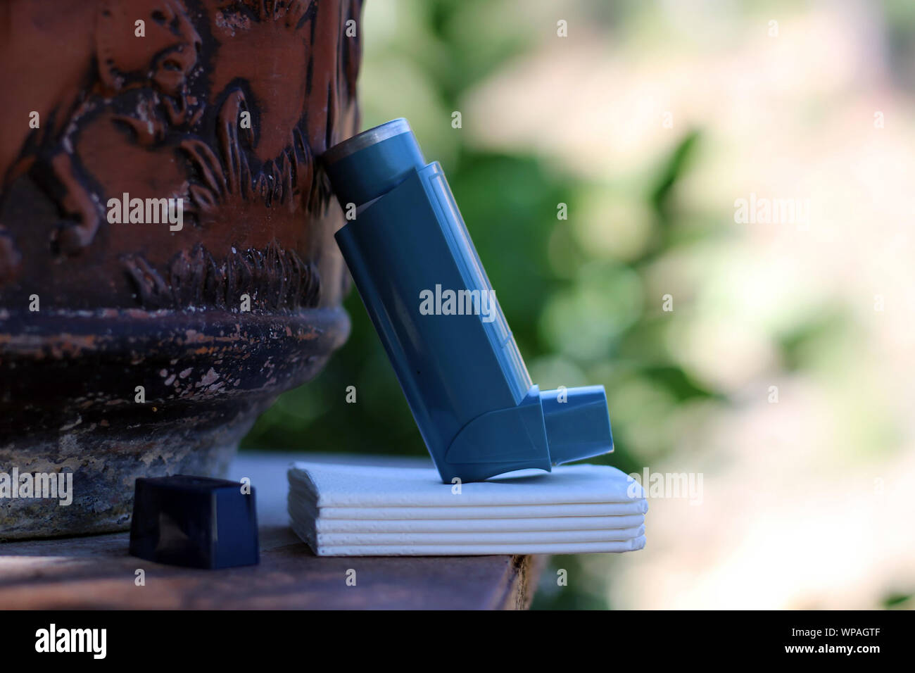Medicine and health concept: Blue inhaler. Pharmaceutical product for ...