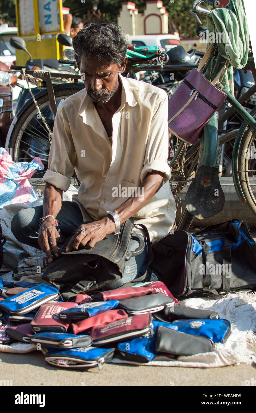 Roadside vendor selling bags on the sidewalk / platform in Chennai