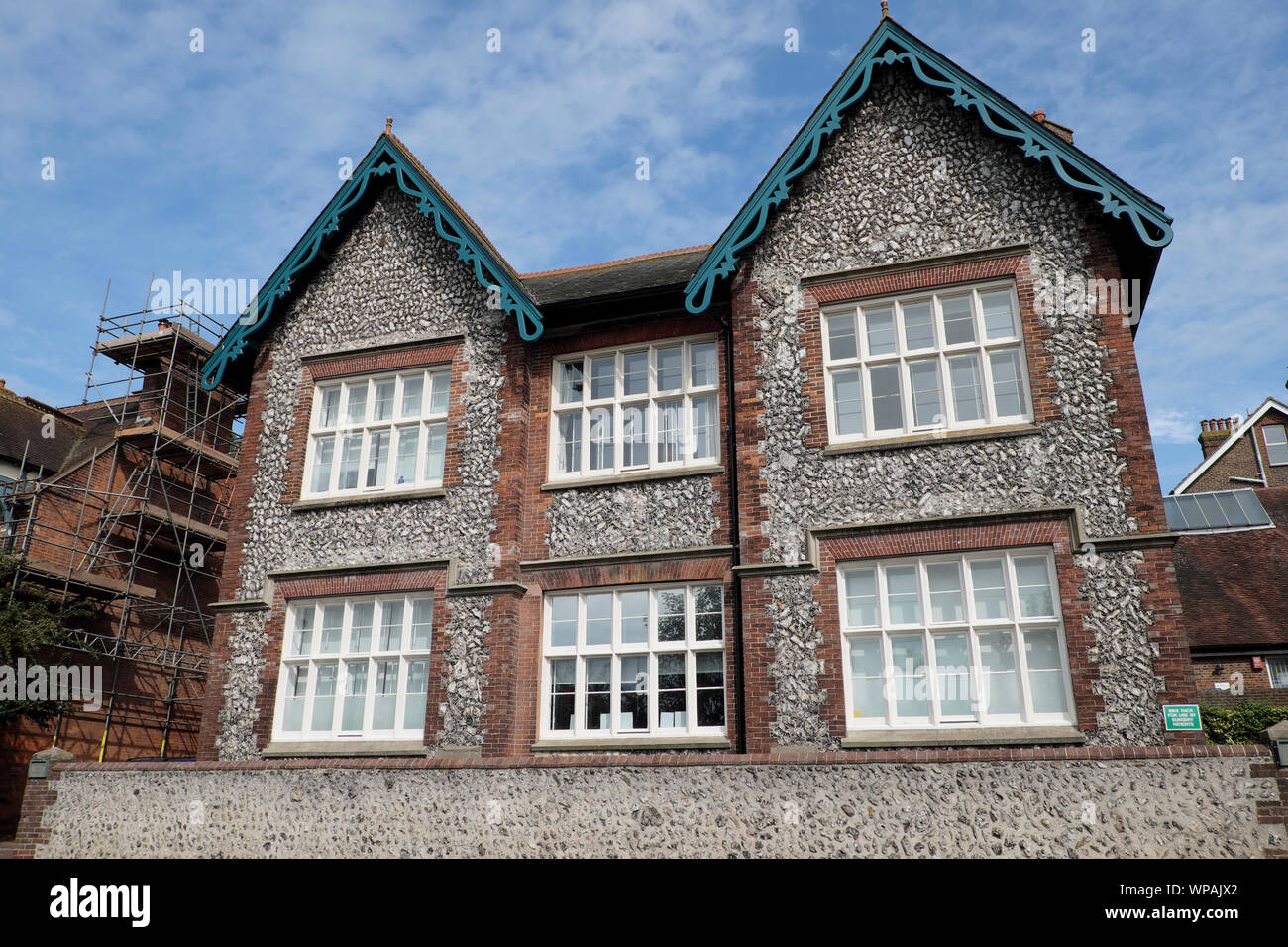 Exterior view of flint wall construction brick and stone house front facade in Lewes East Sussex England UK  KATHY DEWITT Stock Photo