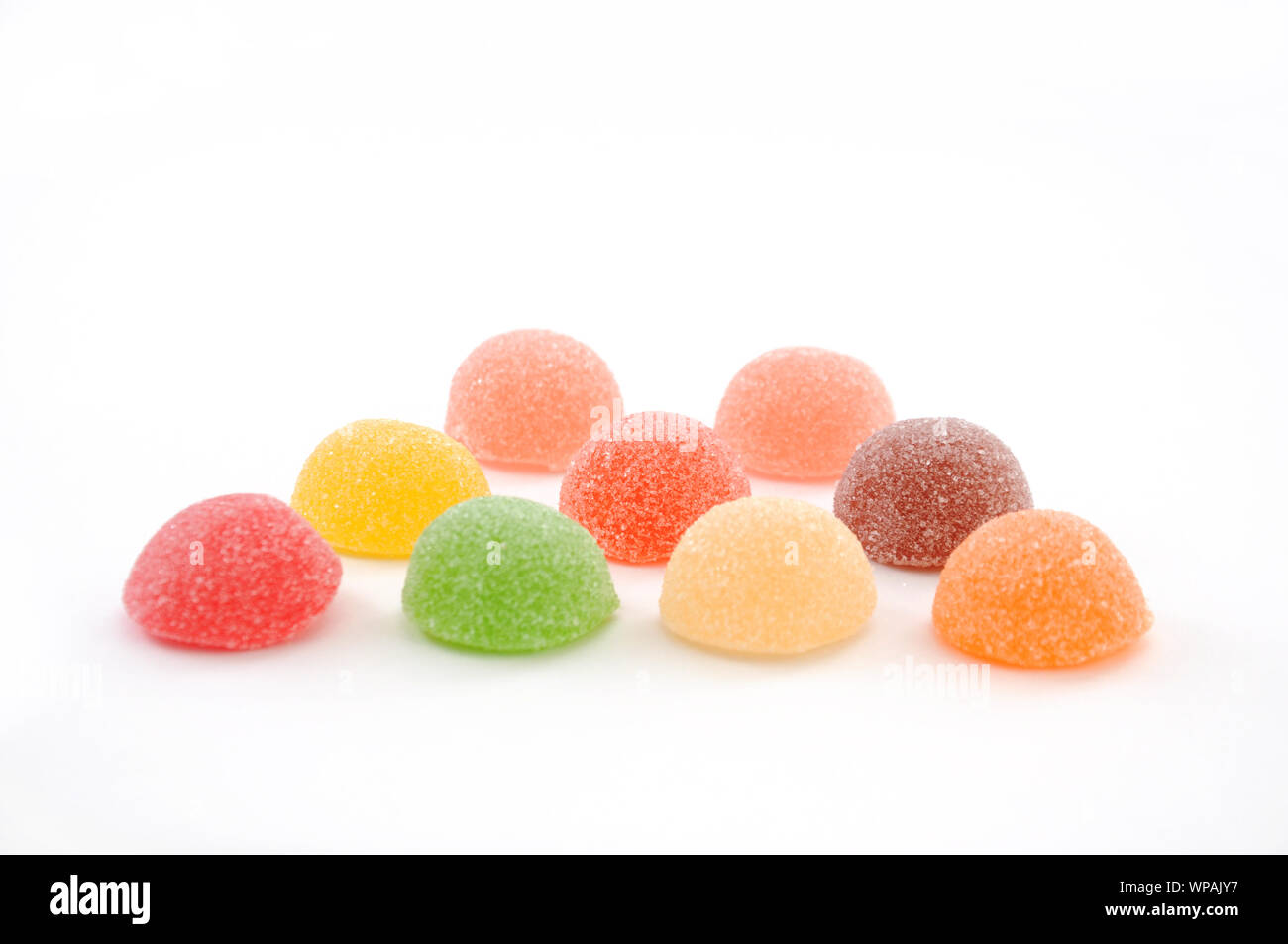 colorful candies jelly beans closeup isolated on a plate on white ...