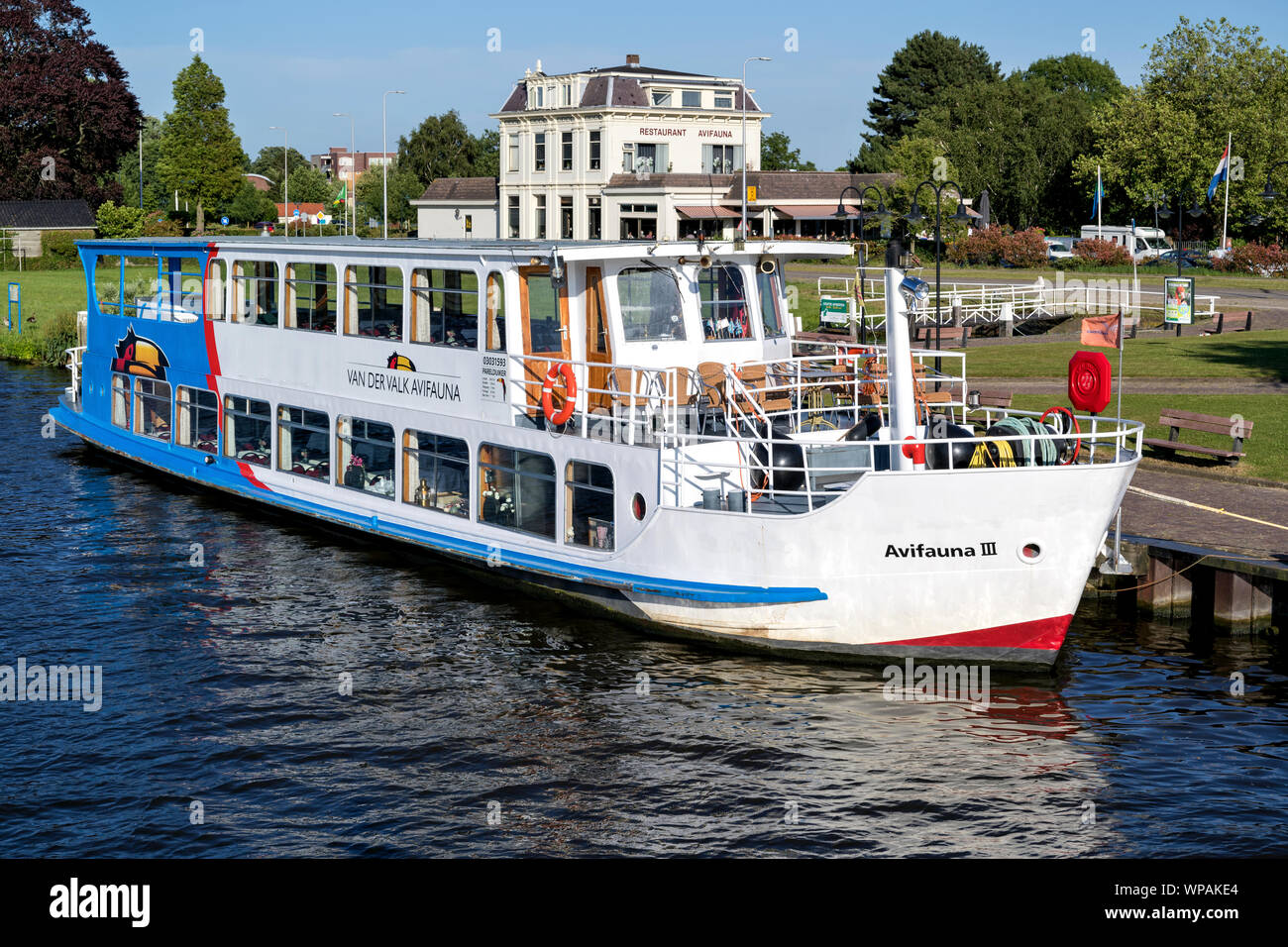 Excursion boat AVIVAUNA III of Van der Valk. Van der Valk is the largest Dutch hospitality chain and also operates the Avifauna Bird Park. Stock Photo