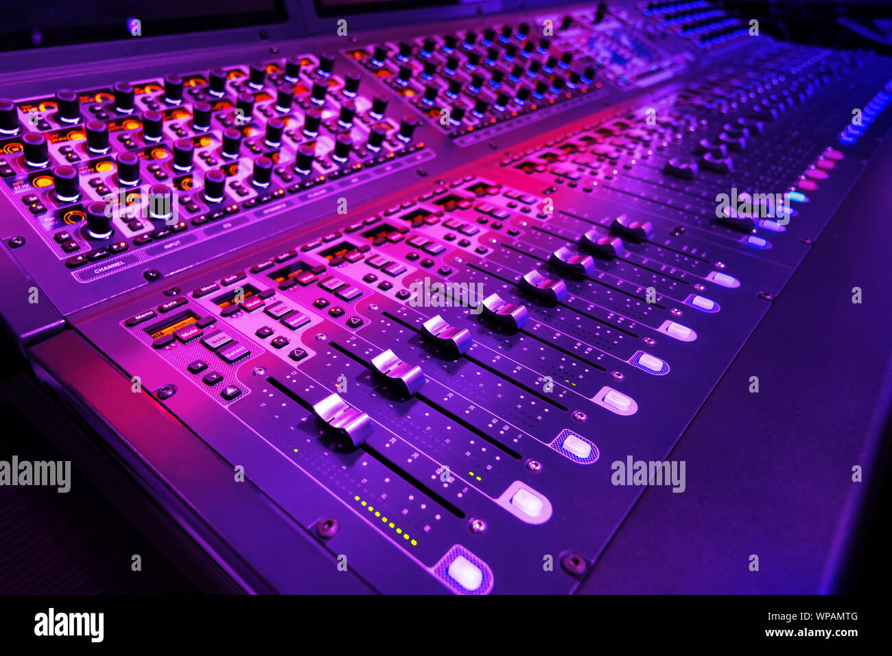 Professional audio studio sound mixer console board panel with recording , faders and adjusting