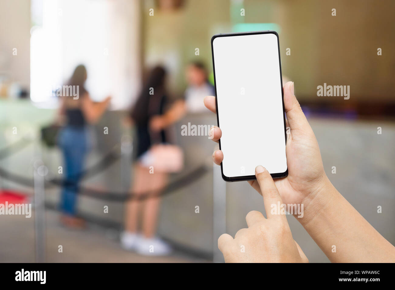 Trip vacation, Hotel reservation, tourism mobile phone mockup. Hand holding blank screen smart phone searching for information of travel plan backgrou Stock Photo