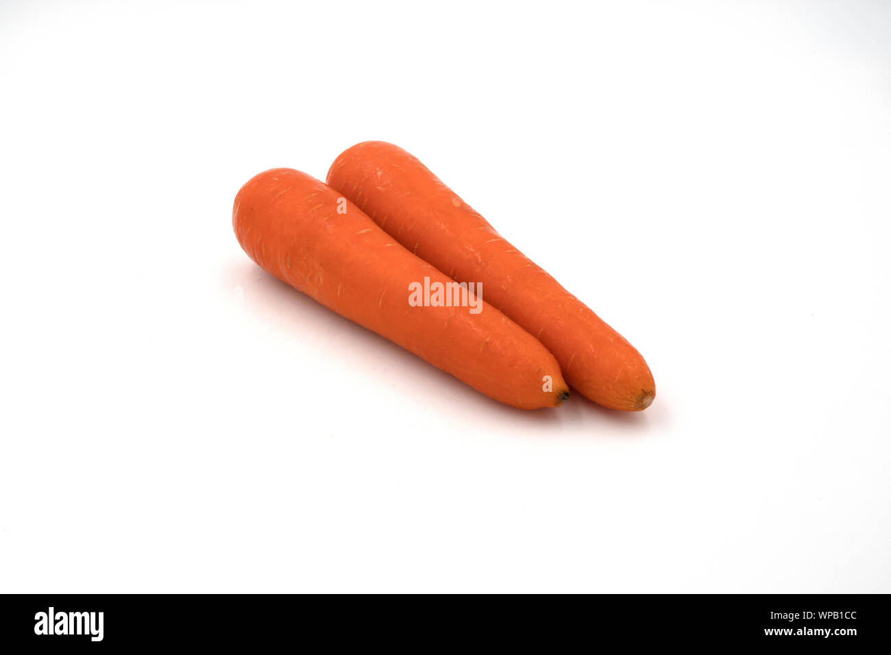 Beautiful sweet fresh raw carrots healthy juices isolated on white