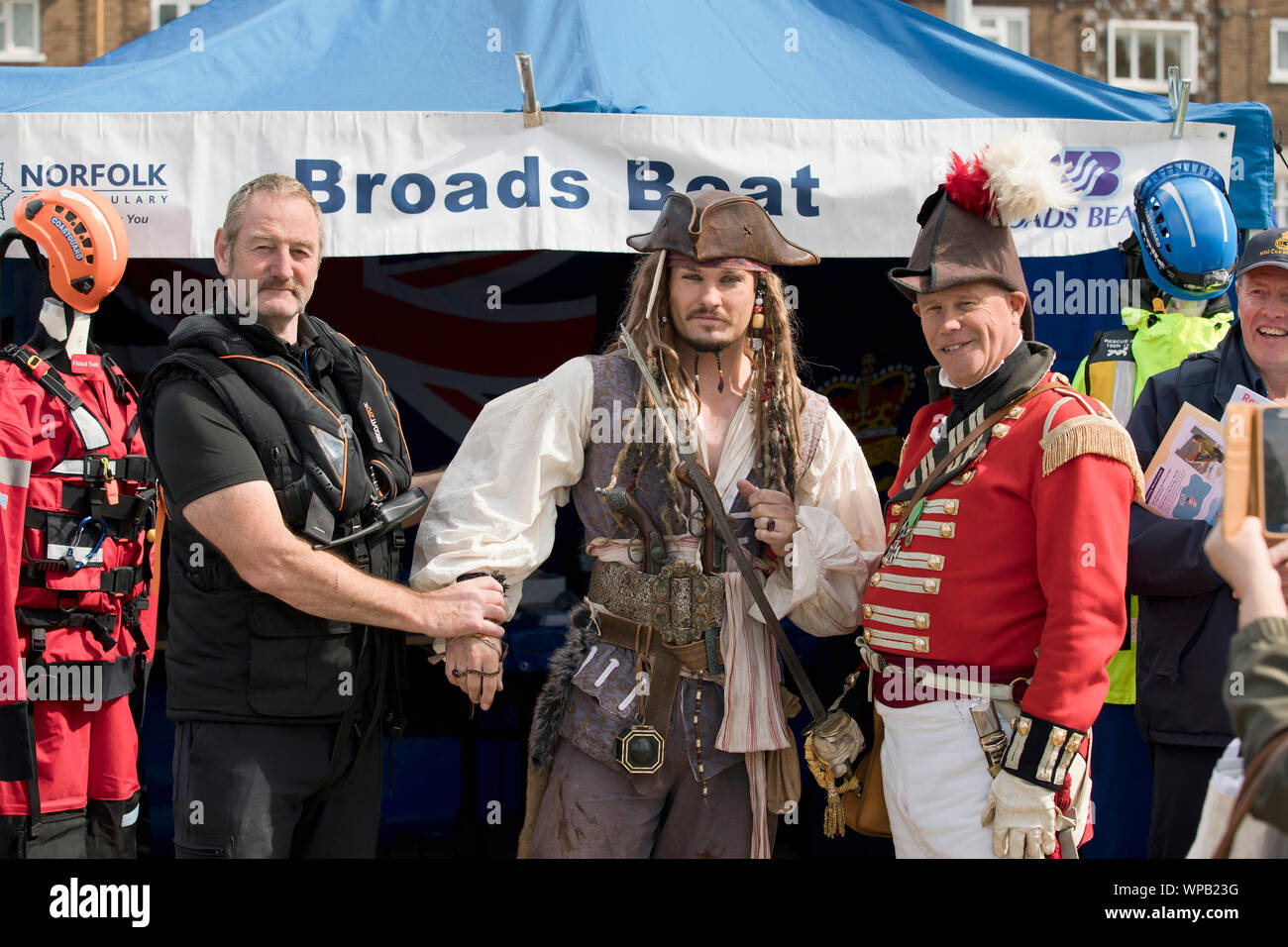 8th September 2019. Great Yarmouth Maritime Festival.  Captain Jack Sparrow, played by look-alike Matt Harris, being handed over to Norfolk Police's Broads Beat officer Derek Rutter by Peter Heath from the East Norfolk Militia re-enactment group. Stock Photo