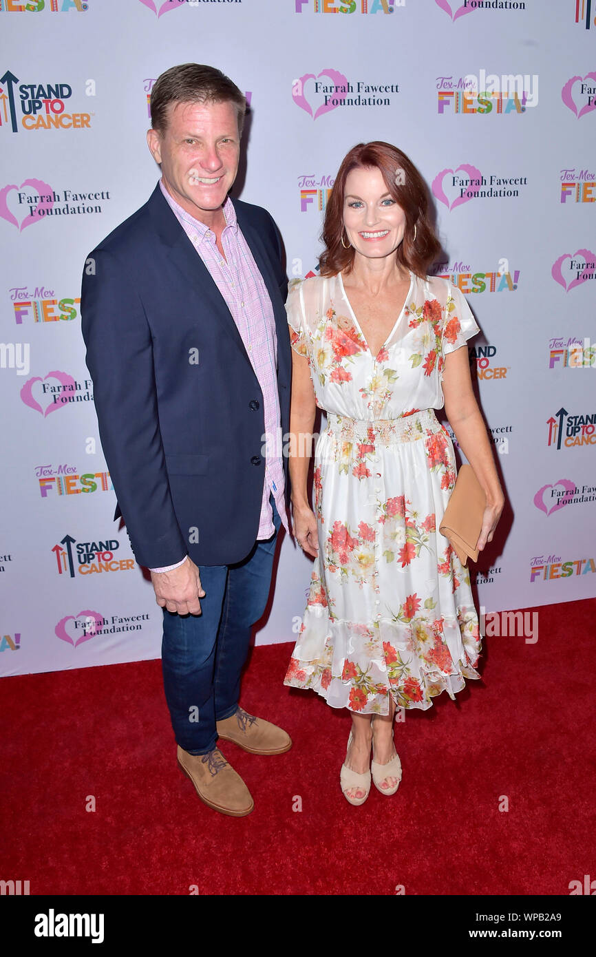 Doug Savant and Laura Leighton attending the Farrah Fawcett Foundation's Tex-Mex Fiesta at Wallis Annenberg Center for the Performing Arts on September 6, 2019 in Beverly Hills, California. Stock Photo