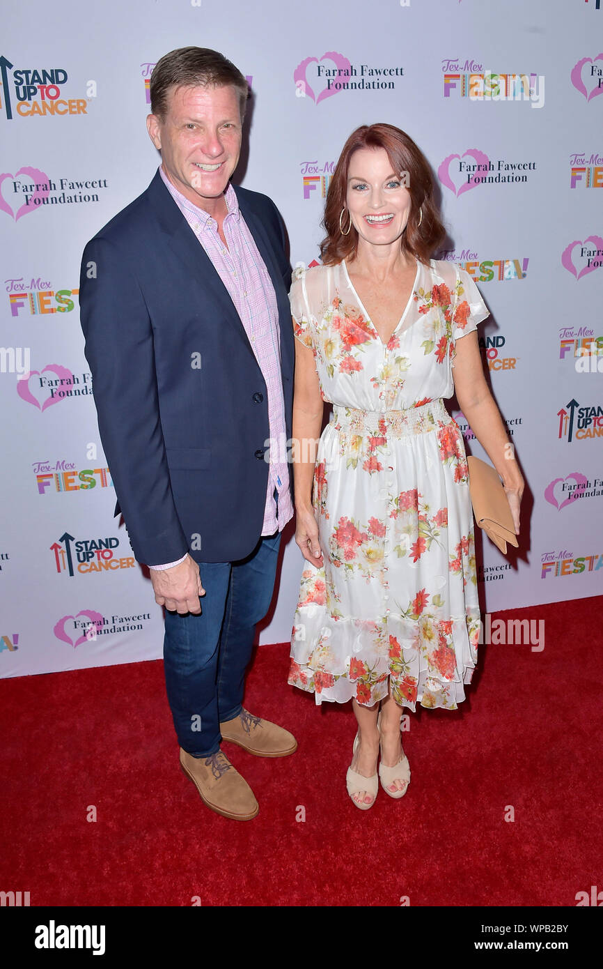 Doug Savant and Laura Leighton attending the Farrah Fawcett Foundation's Tex-Mex Fiesta at Wallis Annenberg Center for the Performing Arts on September 6, 2019 in Beverly Hills, California. Stock Photo