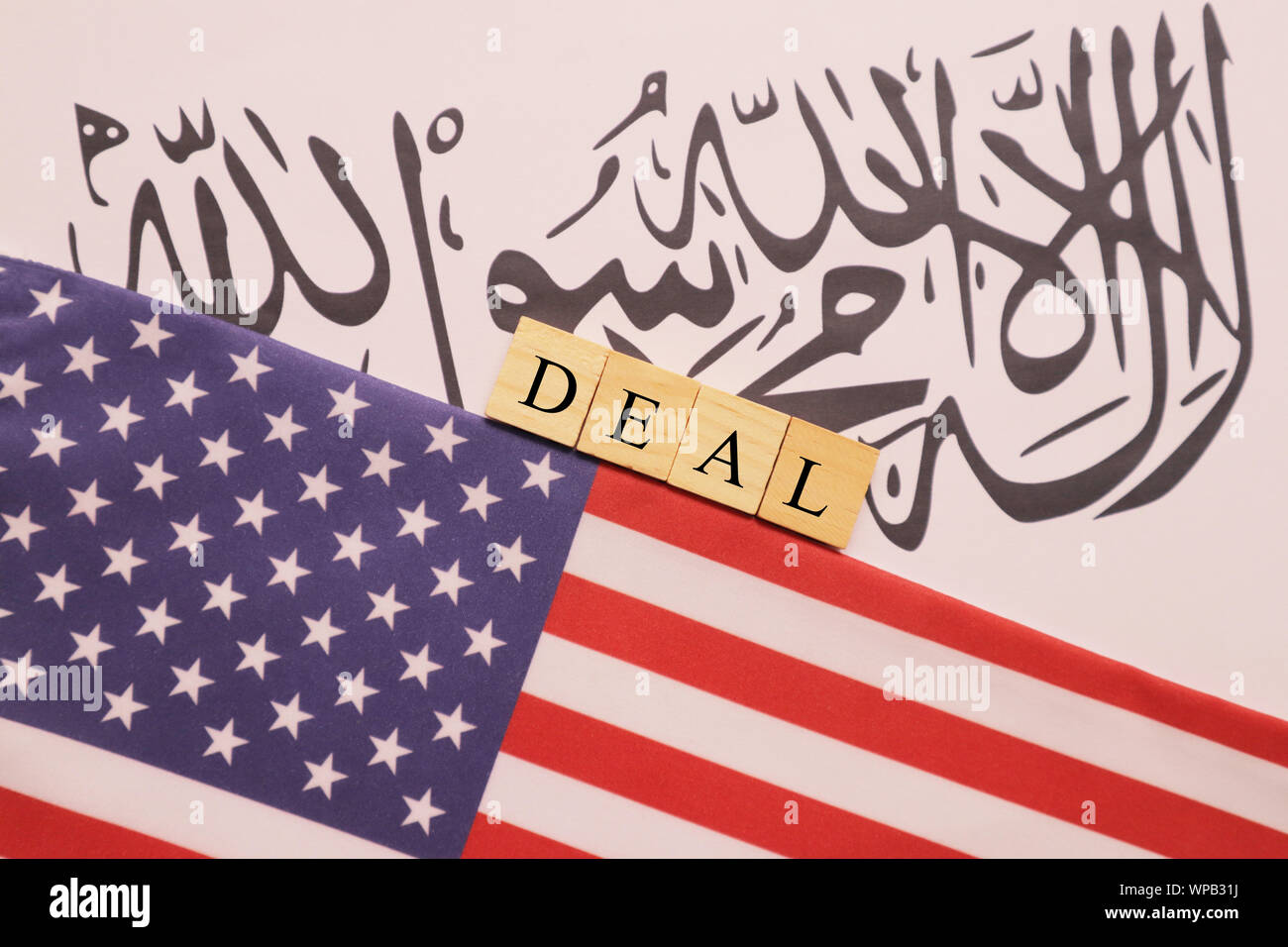 Concept showing of US and Taliban deal preocess showing with flags. Stock Photo