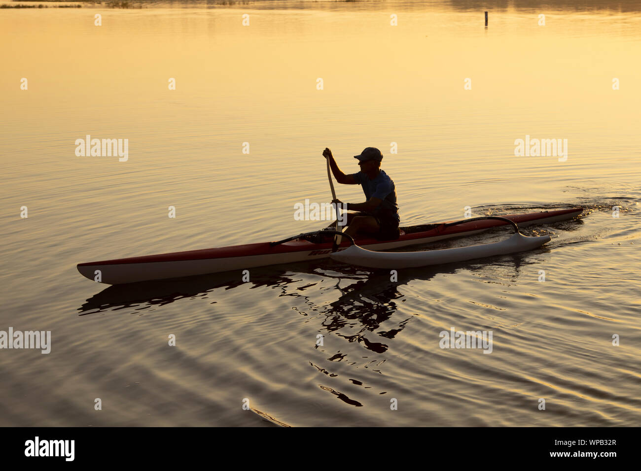 Paddling an outrigger canoe hires stock photography and images Alamy