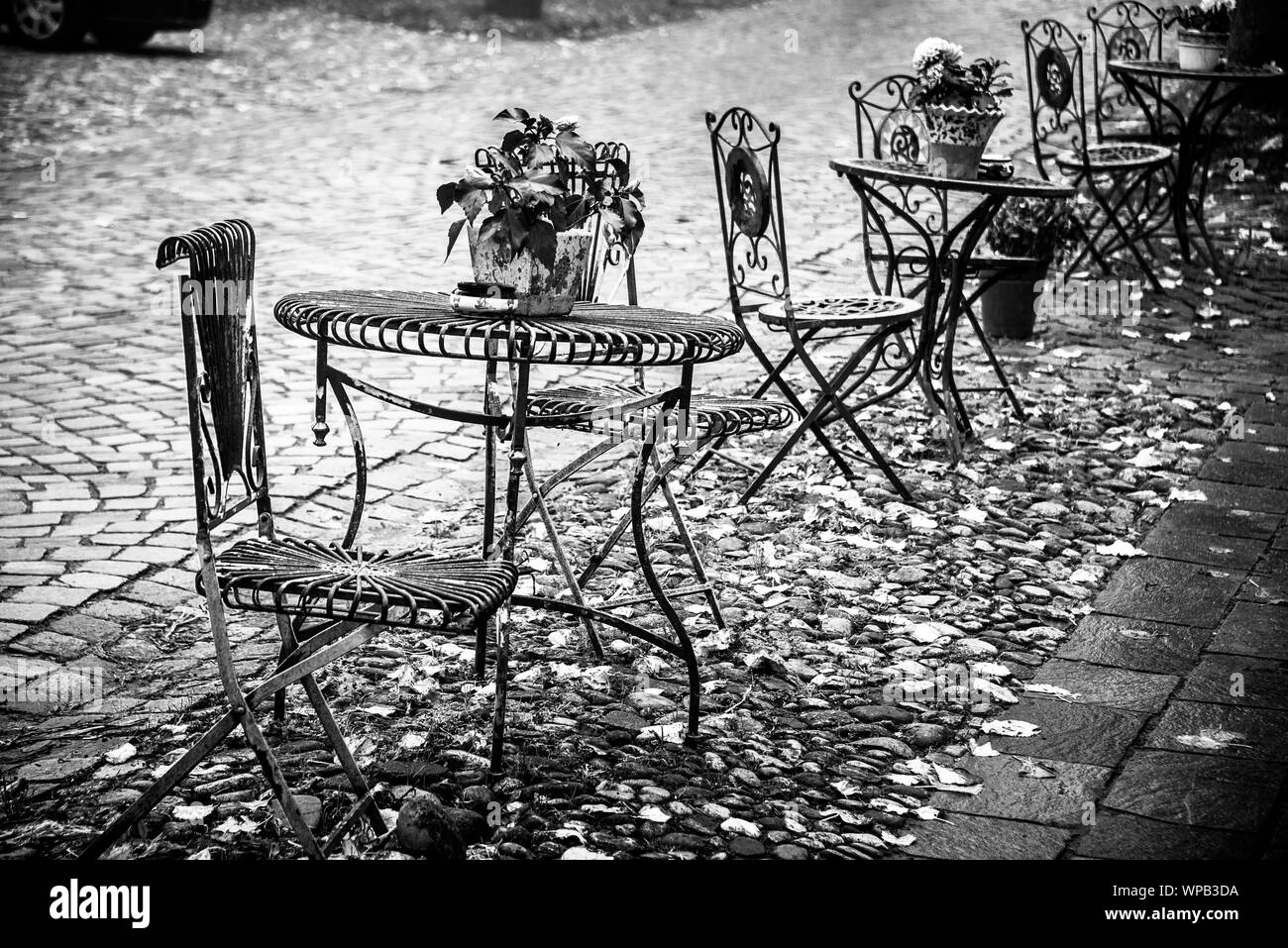 Chairs on tables closed Black and White Stock Photos & Images - Alamy
