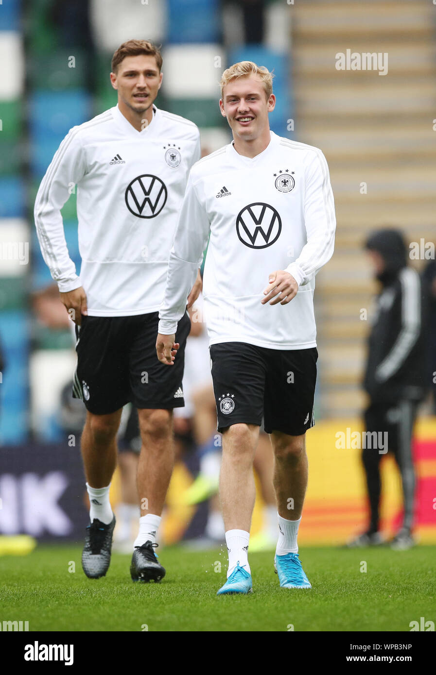 Belfast, UK. 08th Sep, 2019. Soccer: National team, final training Germany before the European Championship qualifier Northern Ireland - Germany in Windsor Park Stadium. The national players Julian Brandt (r) and Niklas Stark warm up. Credit: Christian Charisius/dpa/Alamy Live News Stock Photo