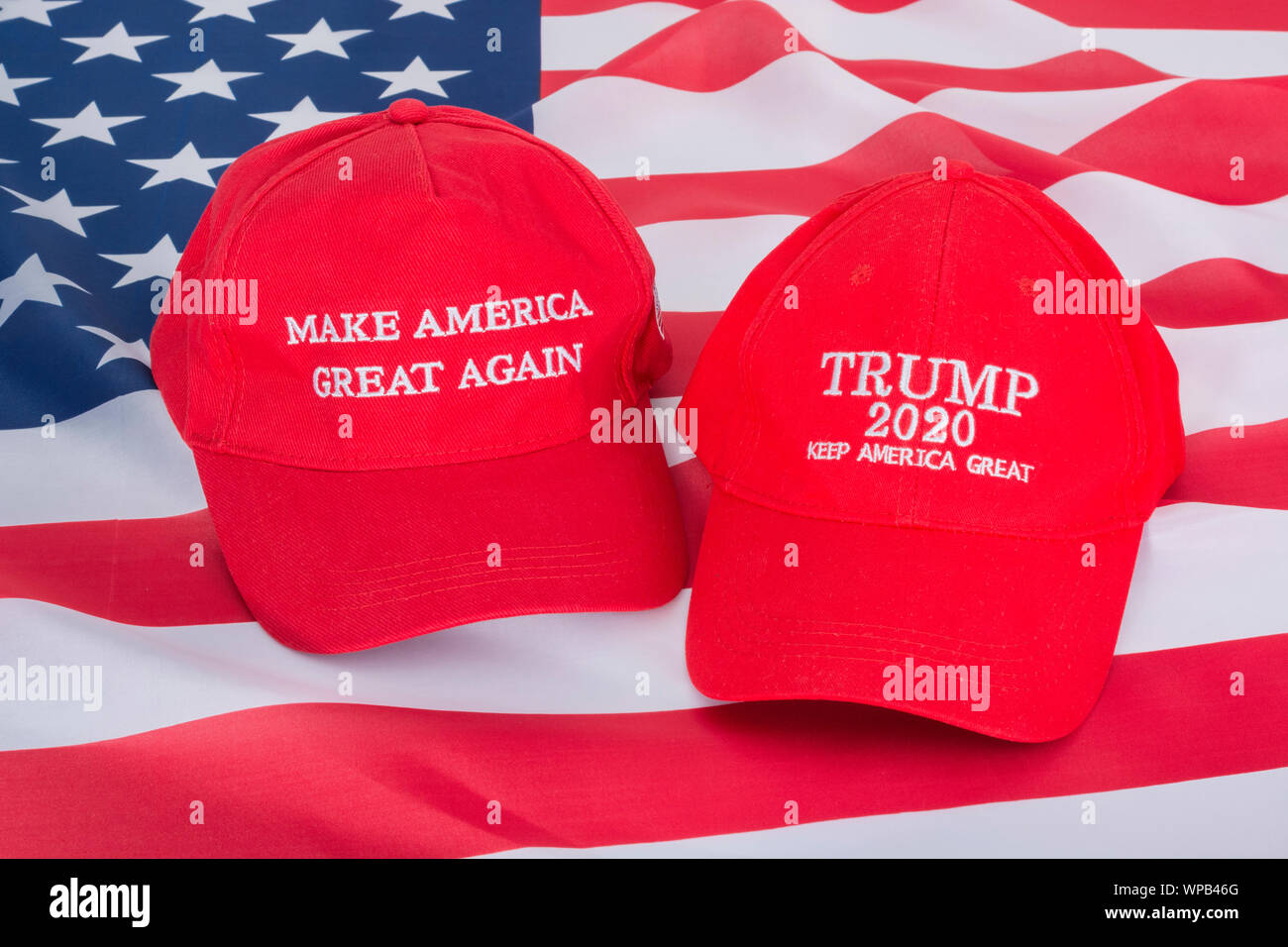 Red Trump MAGA cap & Keep America Great hat + Stars & Stripes. For Trump supporters, Trump presidency, 2020 US election, Trump 2024, Trump America 1st Stock Photo