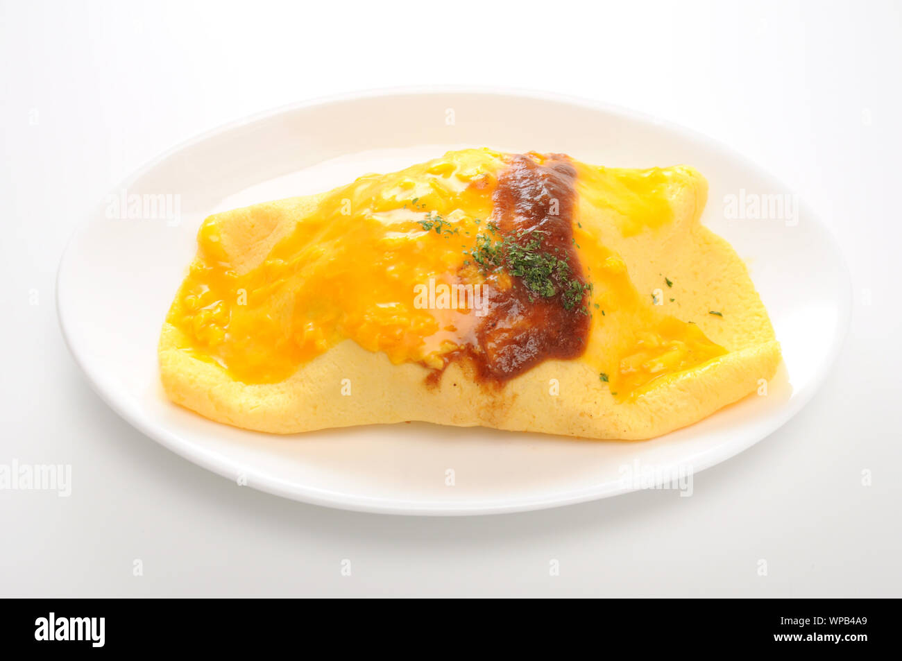 omuraisu omu rice omelet japanese food on plate isolated on white background Stock Photo