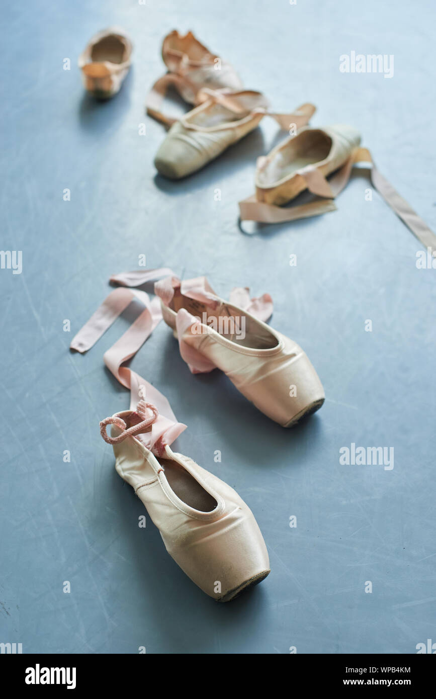 Pair of old ballet shoes on grey background Stock Photo Alamy