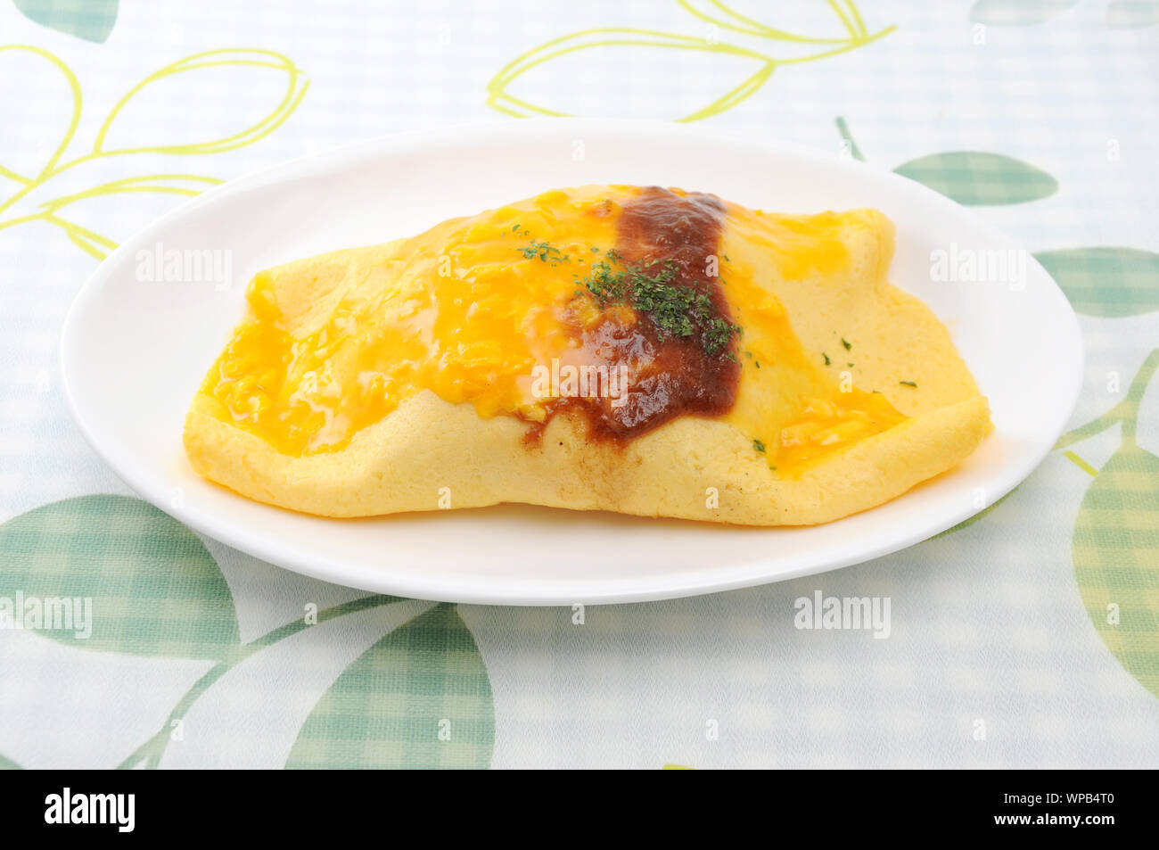 omuraisu omu rice omelet japanese food on plate isolated on table Stock Photo
