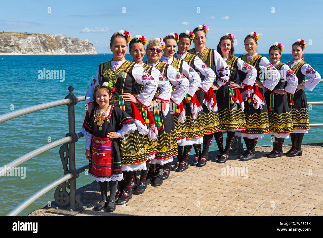 Swanage, Dorset UK. 8th September 2019. Crowds flock to the seaside town of Swanage to enjoy the dancing, with over 50 dance teams including morris dancing for Swanage Folk Festival on a warm sunny day. Zlaten Klas thrill the crowds with their traditional Bulgarian dances. Credit: Carolyn Jenkins/Alamy Live News Stock Photo