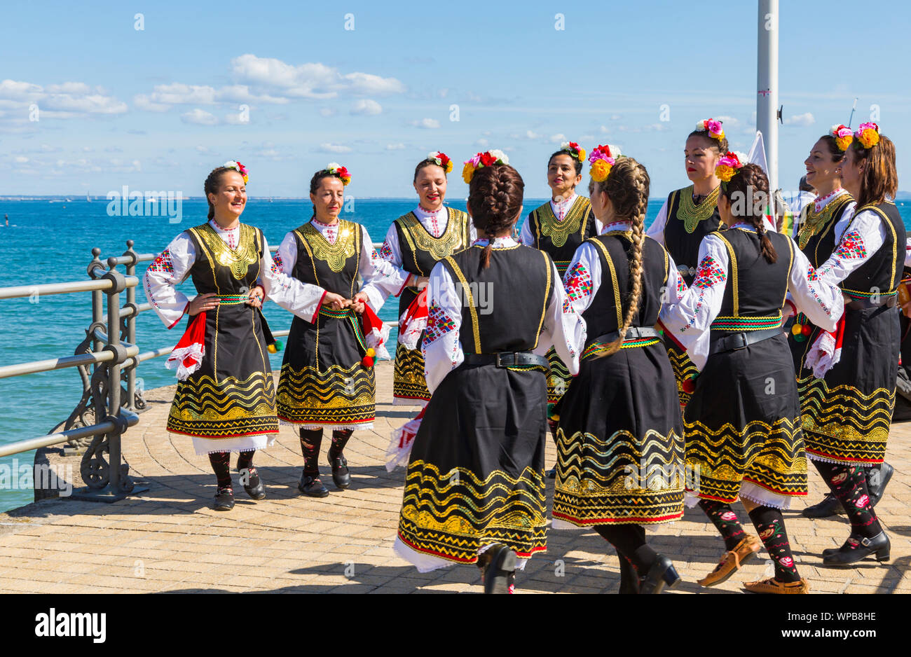 Swanage, Dorset UK. 8th September 2019. Crowds flock to the seaside town of Swanage to enjoy the dancing, with over 50 dance teams including morris dancing for Swanage Folk Festival on a warm sunny day. Zlaten Klas thrill the crowds with their traditional Bulgarian dances. Credit: Carolyn Jenkins/Alamy Live News Stock Photo