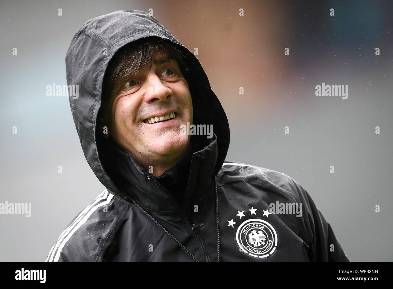 Belfast, UK. 08th Sep, 2019. Soccer: National team, final training Germany before the European Championship qualifier Northern Ireland - Germany in Windsor Park Stadium. National coach Joachim Löw laughs during the training. Credit: Christian Charisius/dpa/Alamy Live News Stock Photo