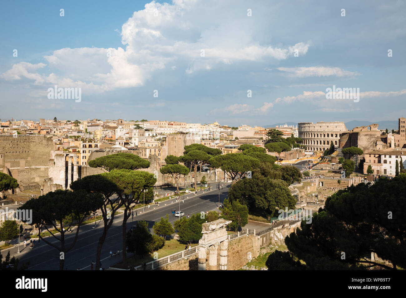 Panoramic view of city Rome with Roman forum and Colosseum from Vittorio Emanuele II Monument also known as the Vittoriano. Summer sunny day and drama Stock Photo