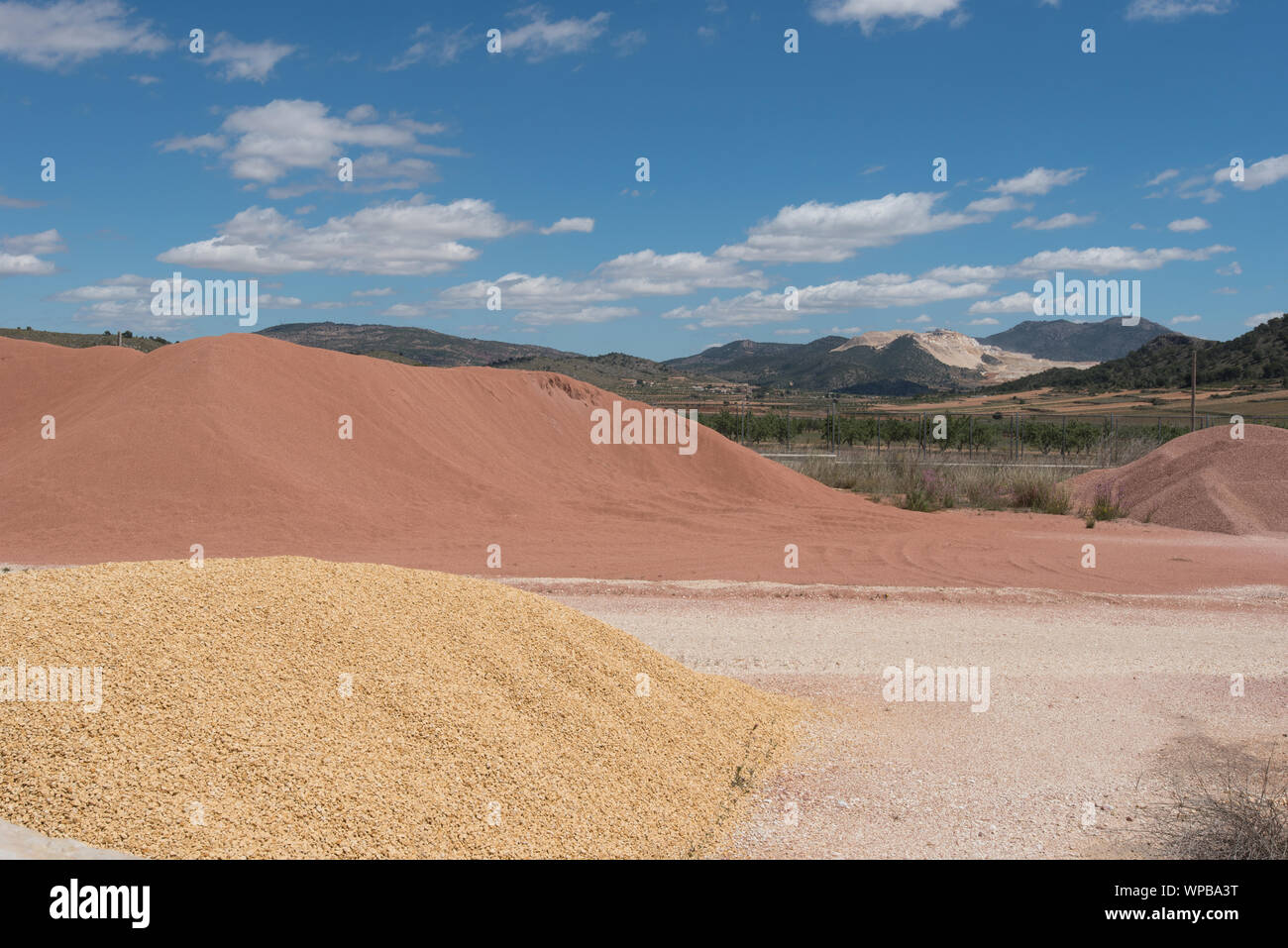 heaps of gravel and sand in surface quarry Stock Photo