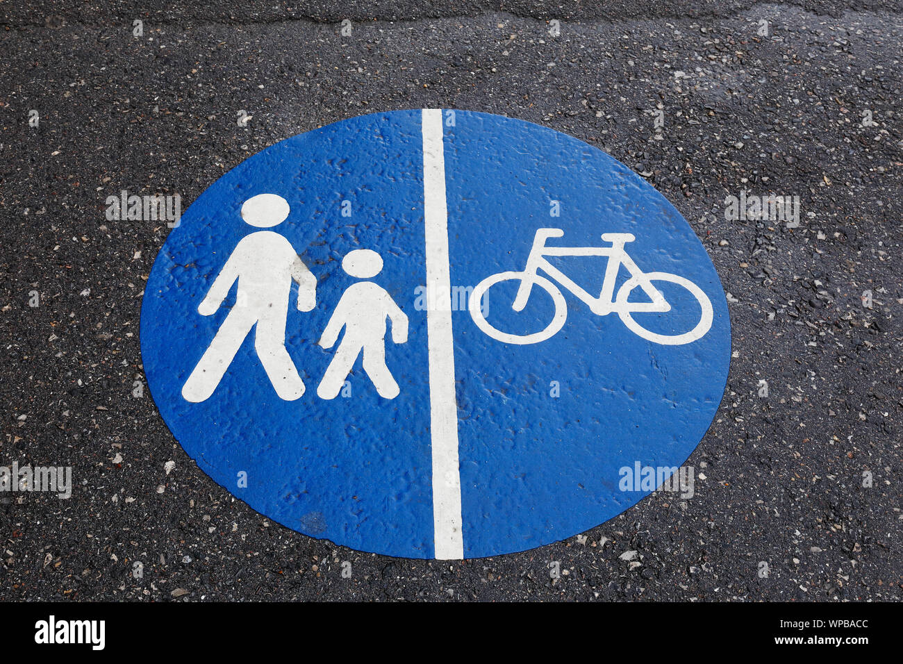 Segregated path road sign painted on asphalt. Stock Photo