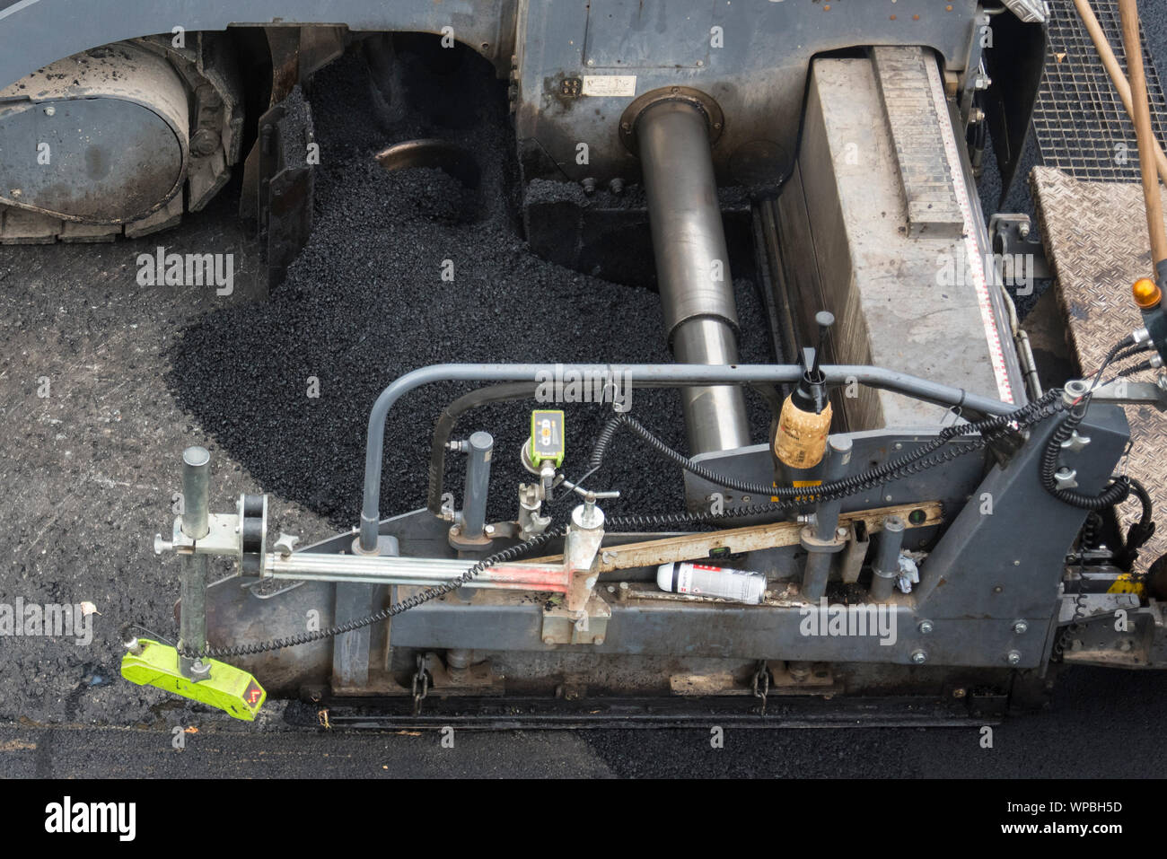 Road works with asphalting new surface Stock Photo