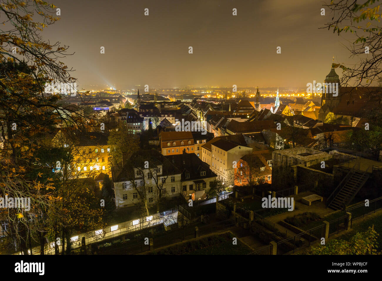 illuminated city view from castle of Pirna at Night, shrouded in Fog, Saxony Stock Photo