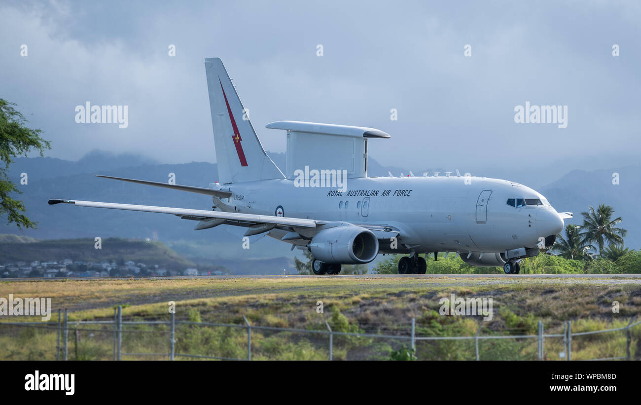 A Royal Australian Air Force E-7A Wedgetail taxis down the Joint Base Pearl Harbor-Hickam flight line Aug. 28, 2019. The command and control aircraft traveled to Hawaii to participate in exercise Sentry Aloha 19-2 and provide airborne early warning support to fourth and fifth generation fighters airframes from the U.S. Air National Guard. The Wedgetails is equipped with a high powered radar, used to monitor the battle space and provide friendly forces with an advantage over their opponents. Sentry Aloha is hosted on a routine basis by the Hawaii Air National Guard’s 154th Wing. (U.S. Air Natio Stock Photo
