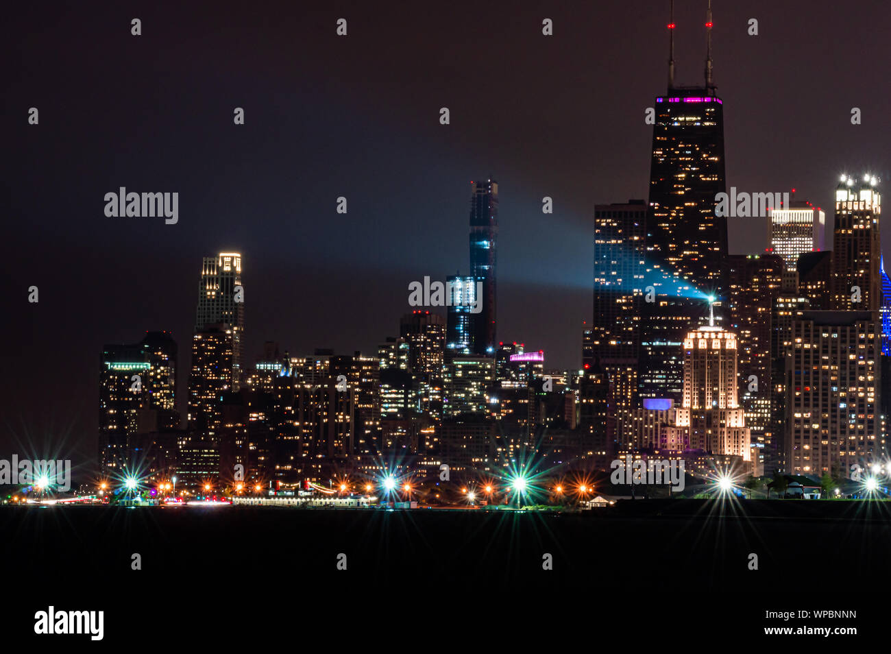 Downtown lights up at night. Chicago skyline from the north lakefront at Diversey Harbor. Stock Photo