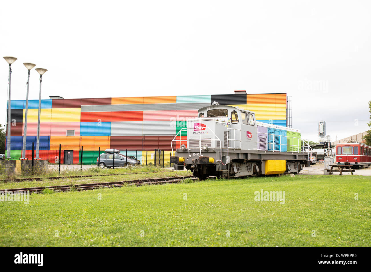 Outdoor displays of trains, including an SNCF locomotive, at the Railway Panorama exhibit at the Cité du Train museum in Mulhouse, France. Stock Photo