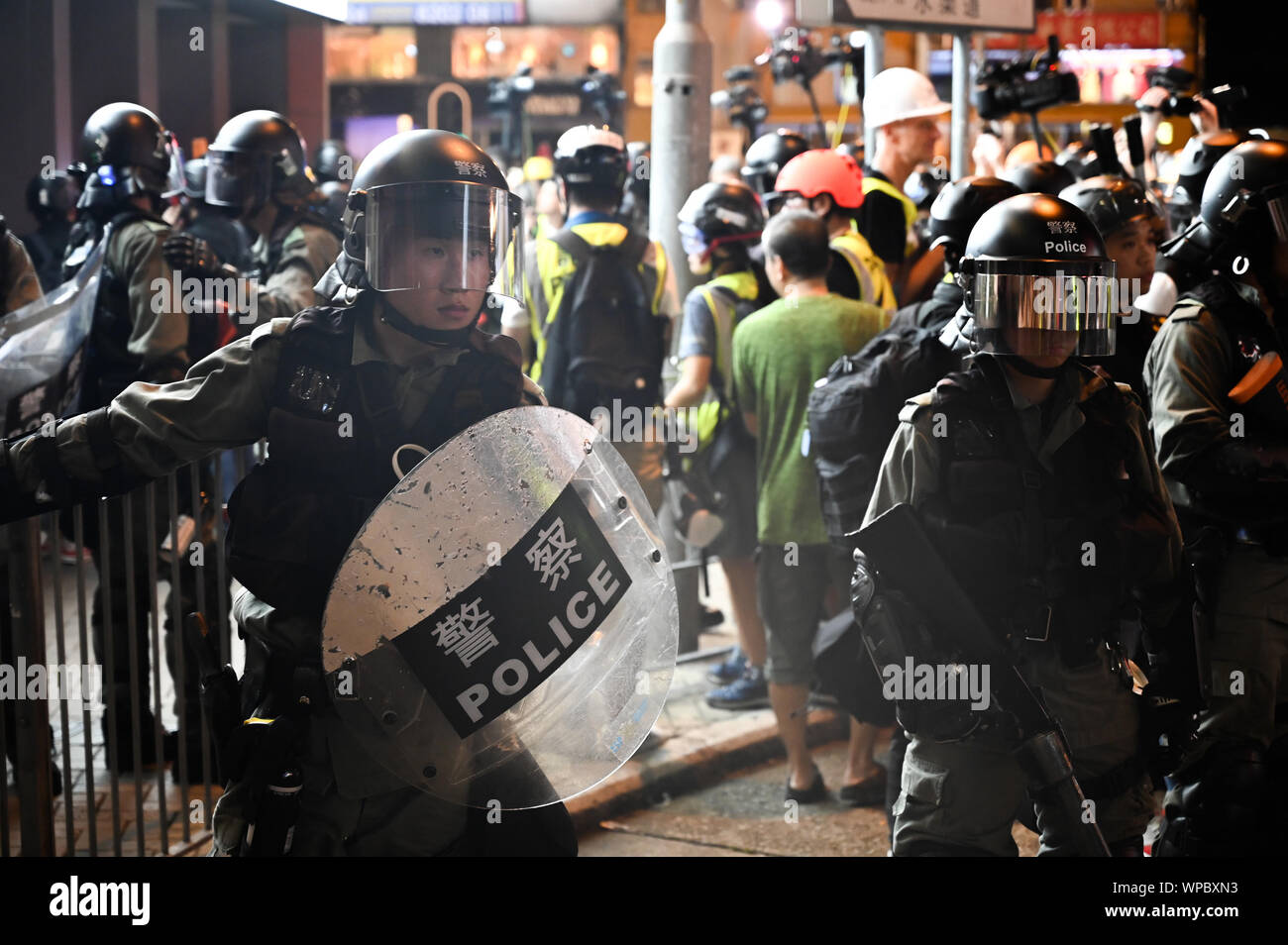 Hong Kong, China. 7th Sep 2019. Riot police stand on a corner in the Mong Kok area of Hong Kong on September 7, 2019, in order to clear crowds of protesters. Police and demonstrators have squared off with increasing frequency and violence as the summer has gone on. Photo by Thomas Maresca/UPIPhoto by Thomas Maresca/UPI Credit: UPI/Alamy Live News Stock Photo