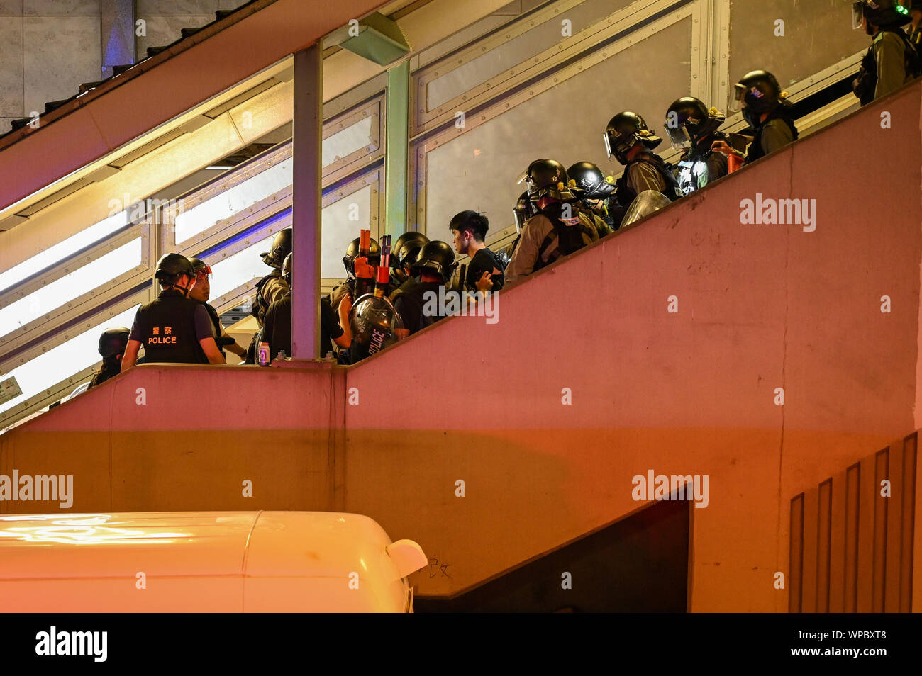 Hong Kong, China. 7th Sep 2019. Riot police make an arrest on a staircase in the Mong Kok area of Hong Kong on September 7, 2019, in order to clear crowds of protesters. Police and demonstrators have squared off with increasing frequency and violence as the summer has gone on. Photo by Thomas Maresca/UPI Credit: UPI/Alamy Live News Stock Photo