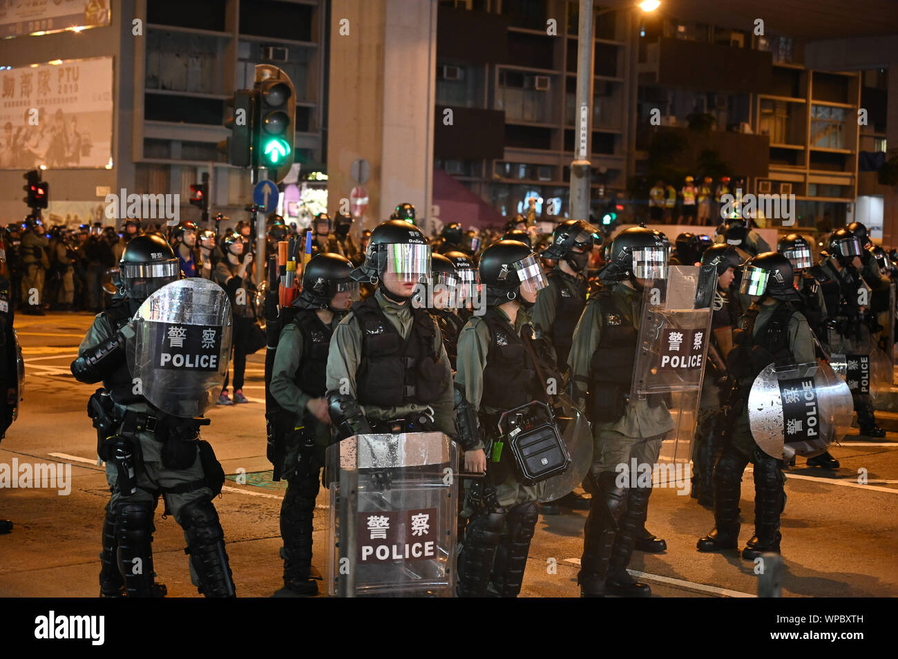 Hong Kong, China. 7th Sep 2019. Riot police stand on a corner in the Mong Kok area of Hong Kong on September 7, 2019, in order to clear crowds of protesters. Police and demonstrators have squared off with increasing frequency and violence as the summer has gone on. Photo by Thomas Maresca/UPI Credit: UPI/Alamy Live News Stock Photo
