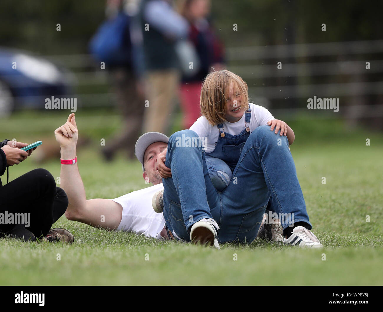 Mike and Mia Tindall have some fun before watching Zara Tindall, who is  competing on Class Affair, on cross country day (day three) at The Land  Rover Burghley Horse Trials, Stamford, Lincolnshire,