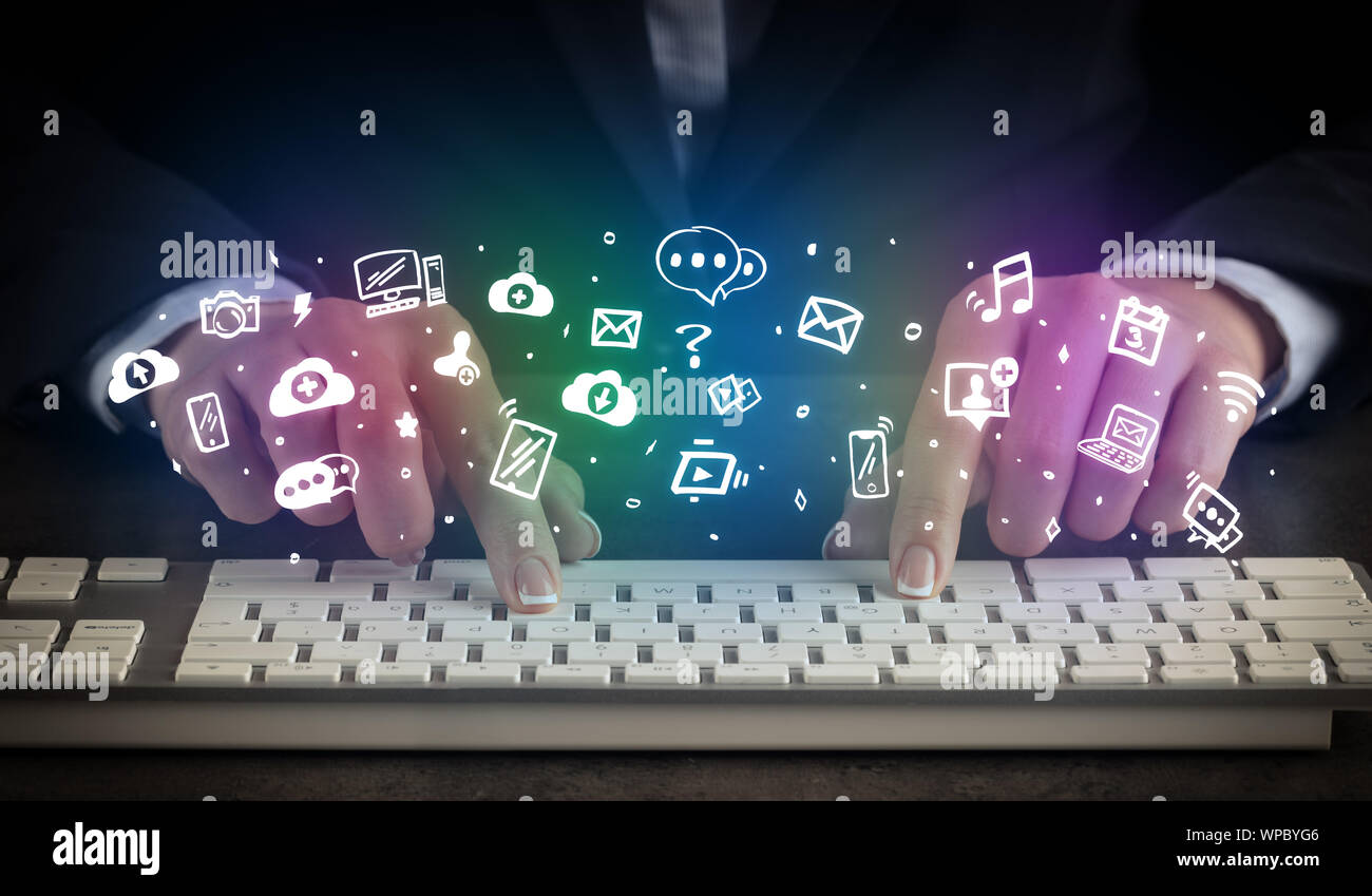 Blogger woman typing on keyboard with drawn application icons around ...