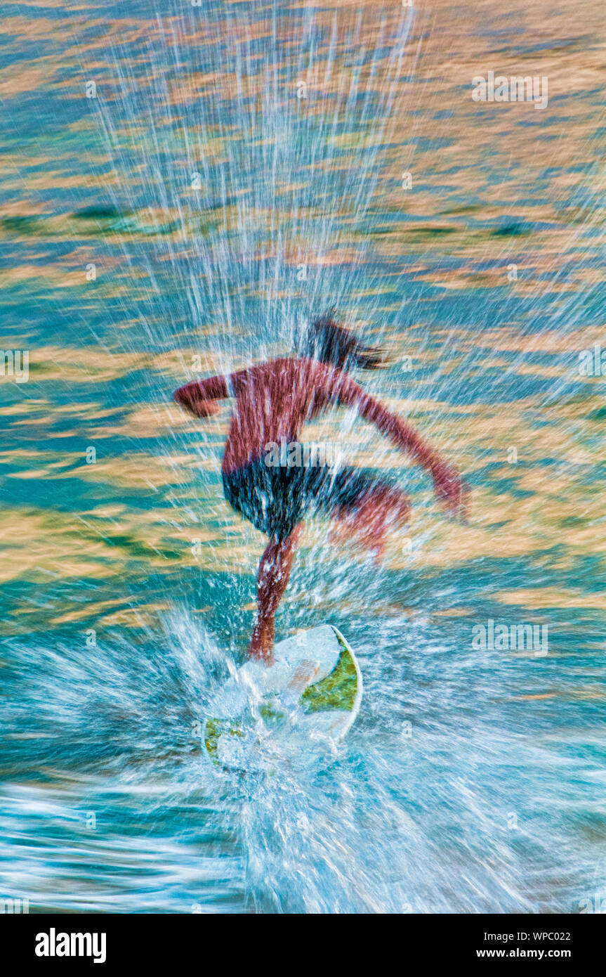 Teenage boy skimboarding on the tropical island of Kauai, Hawaii, USA Stock Photo Alamy