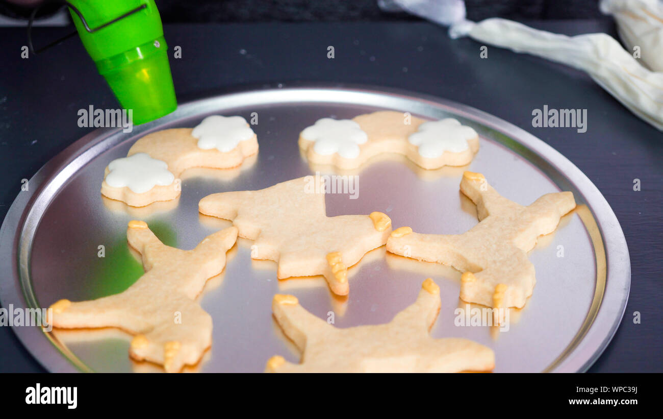 Step by step. Drying royal icing on unicorn sugar cookies with small