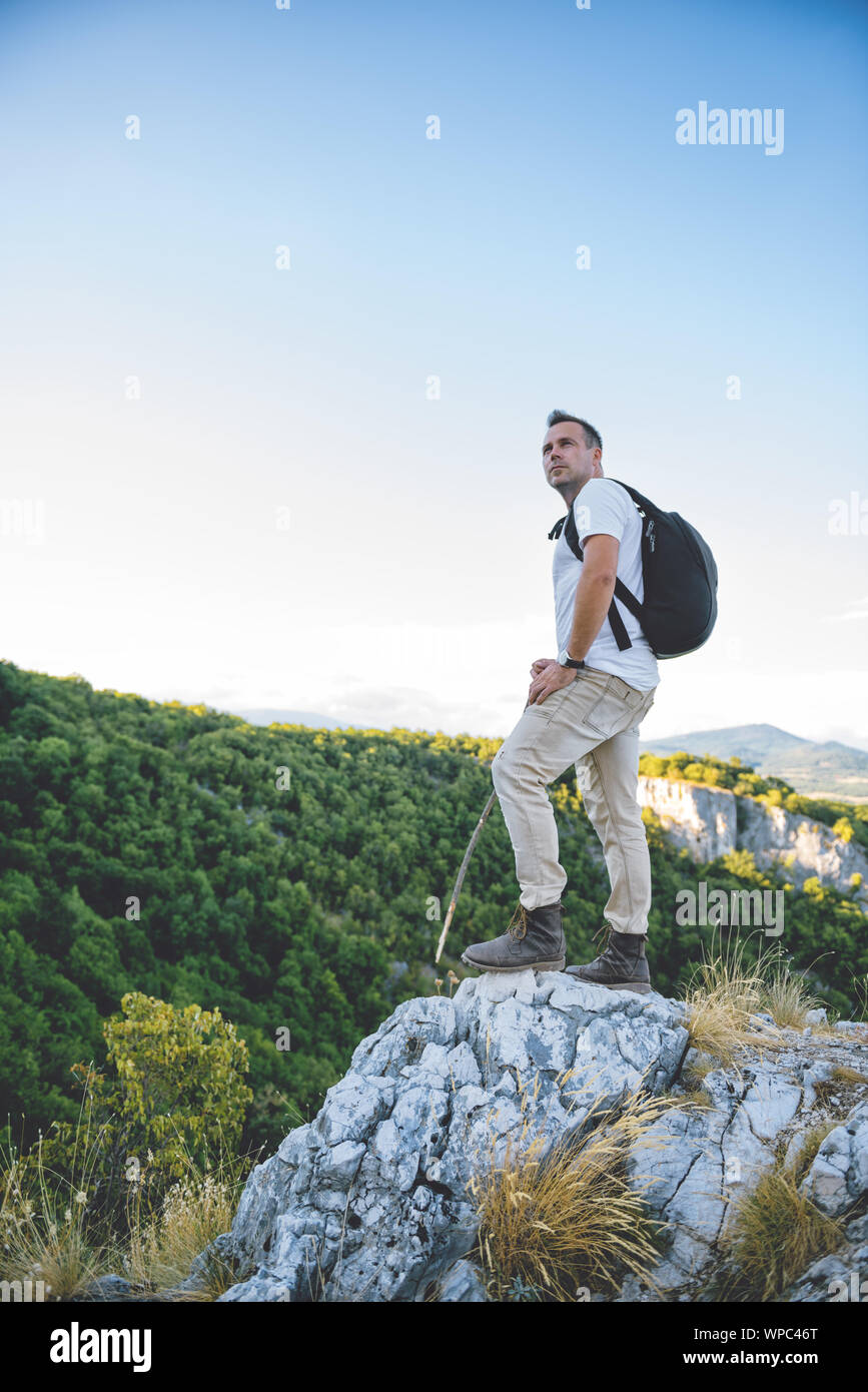 Hiker standing on mountain hi-res stock photography and images - Alamy