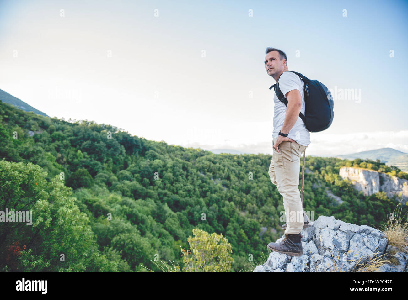 Hiker standing on mountain top hi-res stock photography and images - Alamy