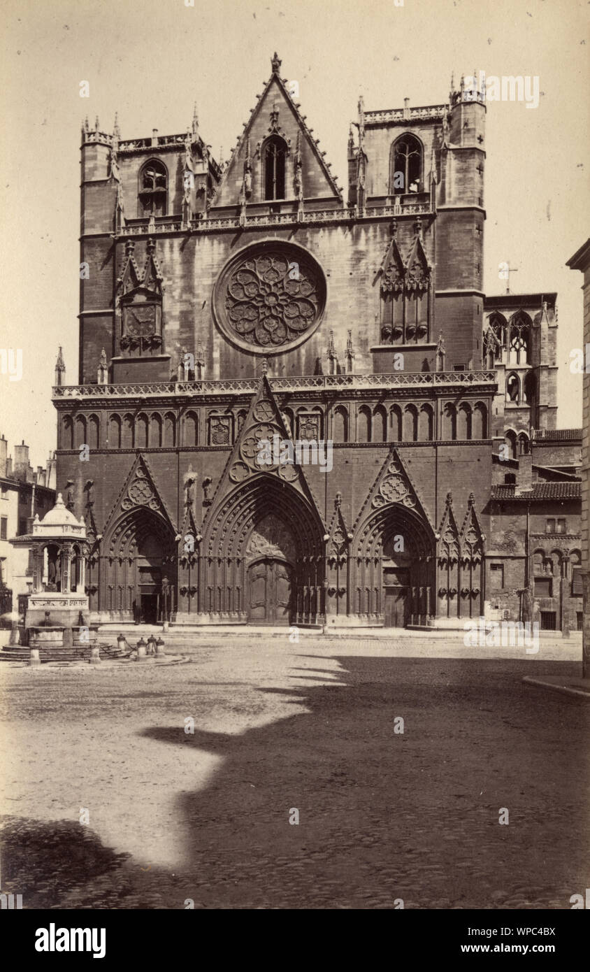 Antique photograph of Lyon Cathedral, France, 19th Century. Lyon Cathedral (French: Cathedrale Saint-Jean-Baptiste de Lyon) is a Roman Catholic church located on Place Saint-Jean in Lyon, France. The cathedral is dedicated to Saint John the Baptist, and is the seat of the Archbishop of Lyon. Stock Photo