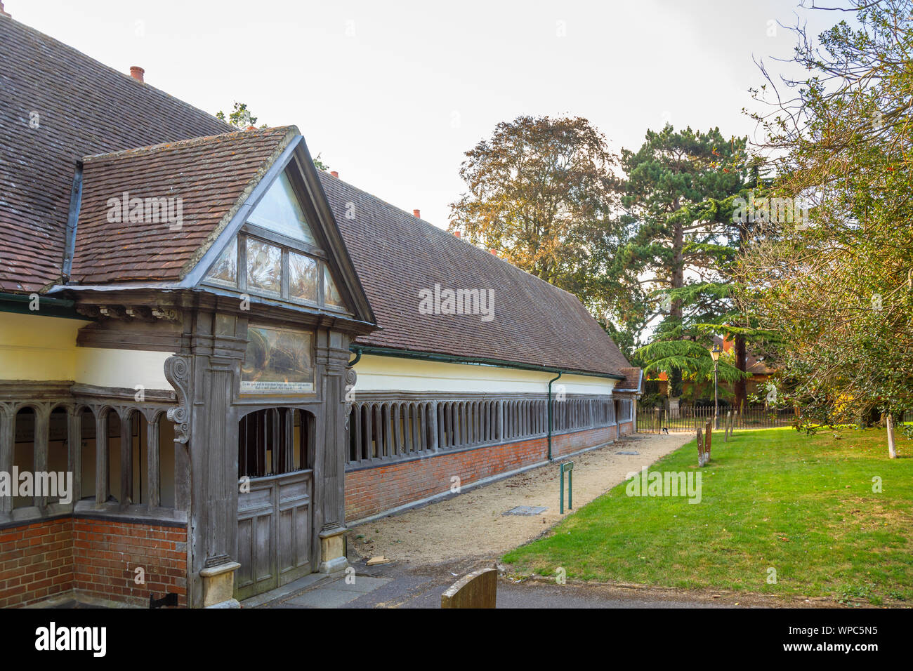 Gabled porch and cloister walk of historic 17th century Long Alley Almshouses, Abingdon-on-Thames, Oxfordshire, south-east England, UK Stock Photo