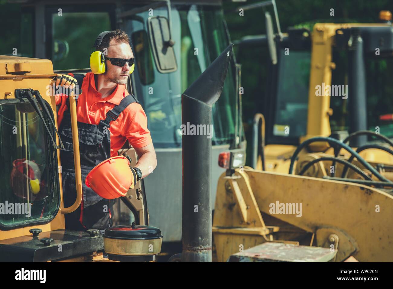 Caucasian Dozer Operator in His 30s. Construction Heavy Equipment