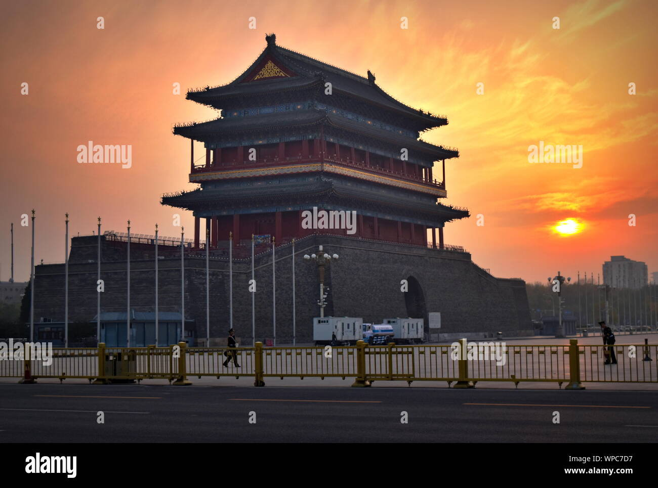 Tiananmen square 15th century Zhengyang gatehouse against dramatic sunset sky, Beijing, China Stock Photo