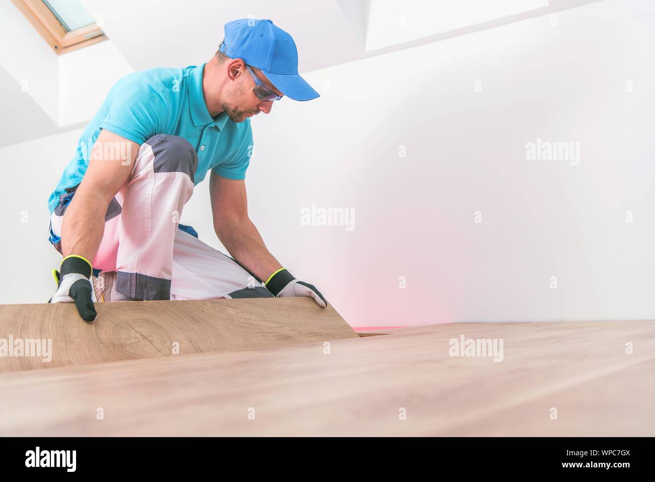 Wooden Floor Panels Replacing By Professional Installer In His 30s