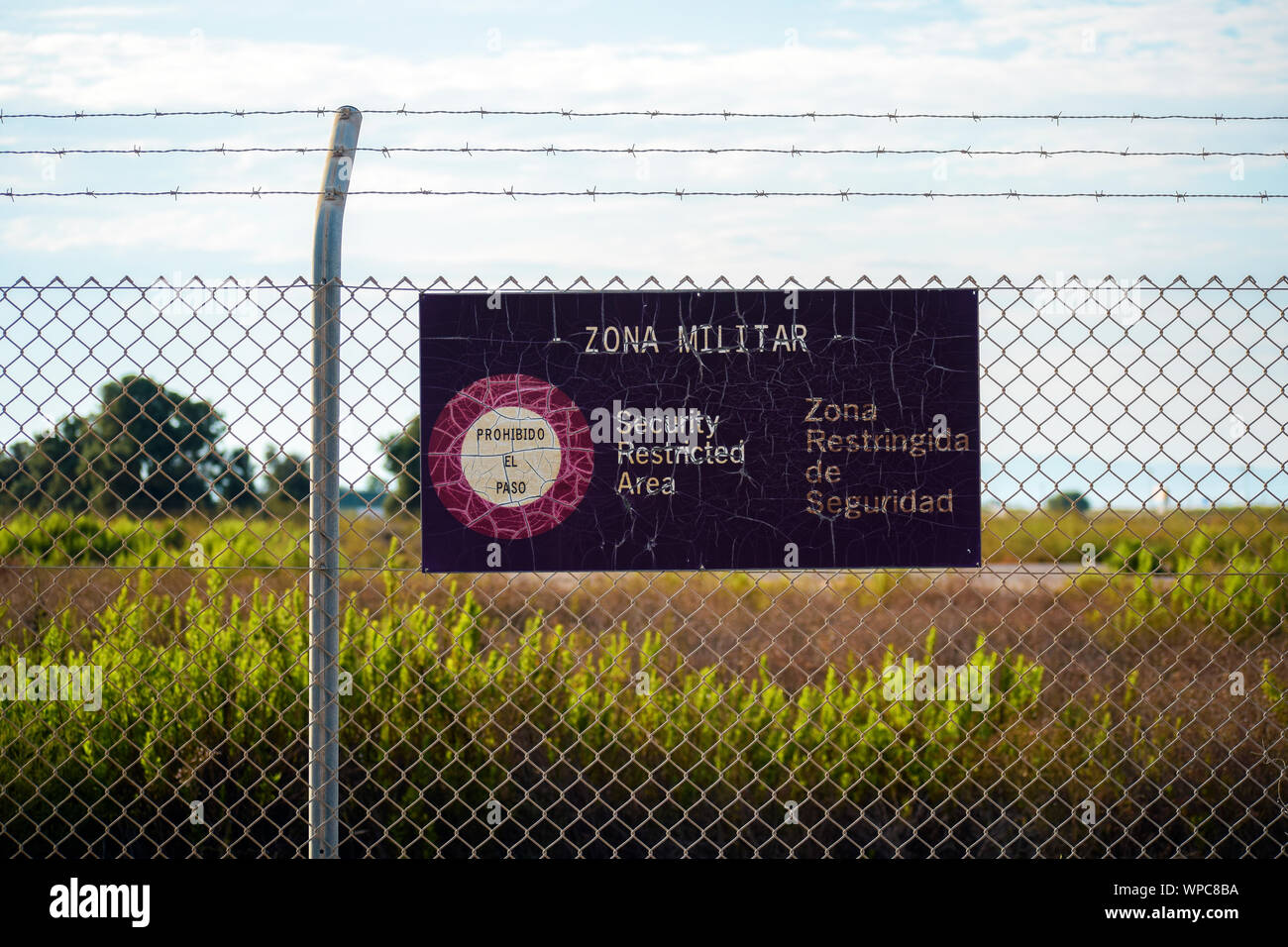 Military zone of restricted access in Spain. Private area. Warning sign to no trespassing. Prohibition in the airport of San Javier, Spain, 2019. Stock Photo