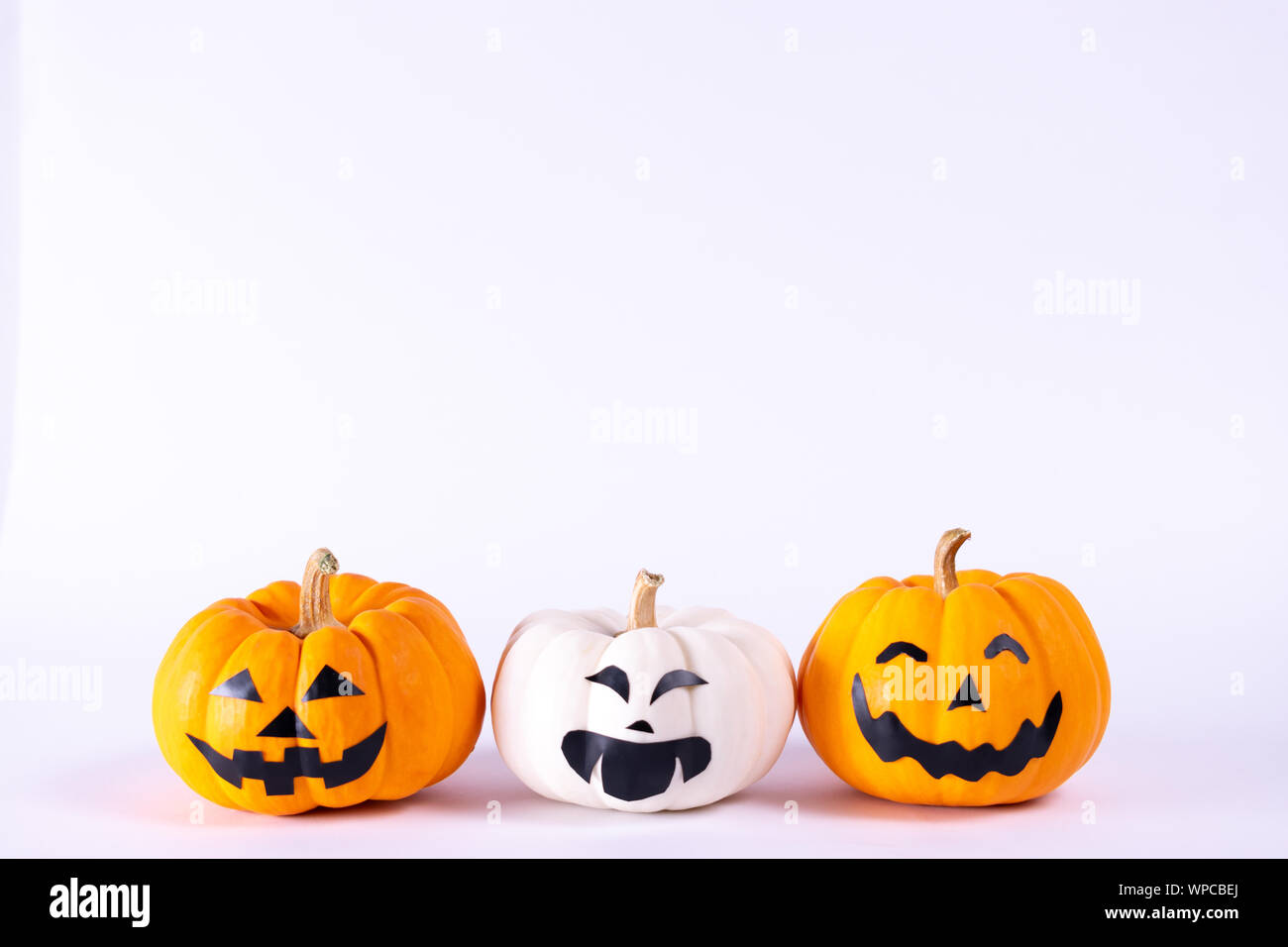 Halloween concept. orange and white pumpkins over white background ...