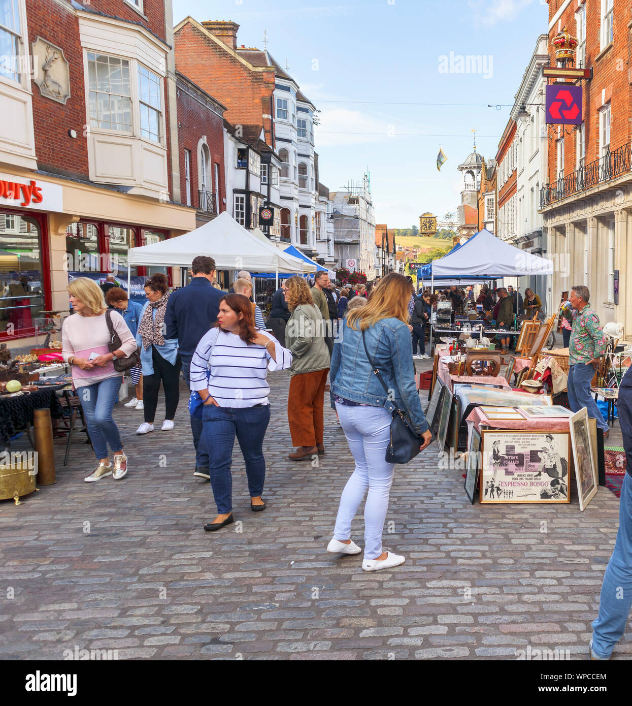 Stall view at popular, busy Sunday Guildford Antique & Brocante Street Market along High Street